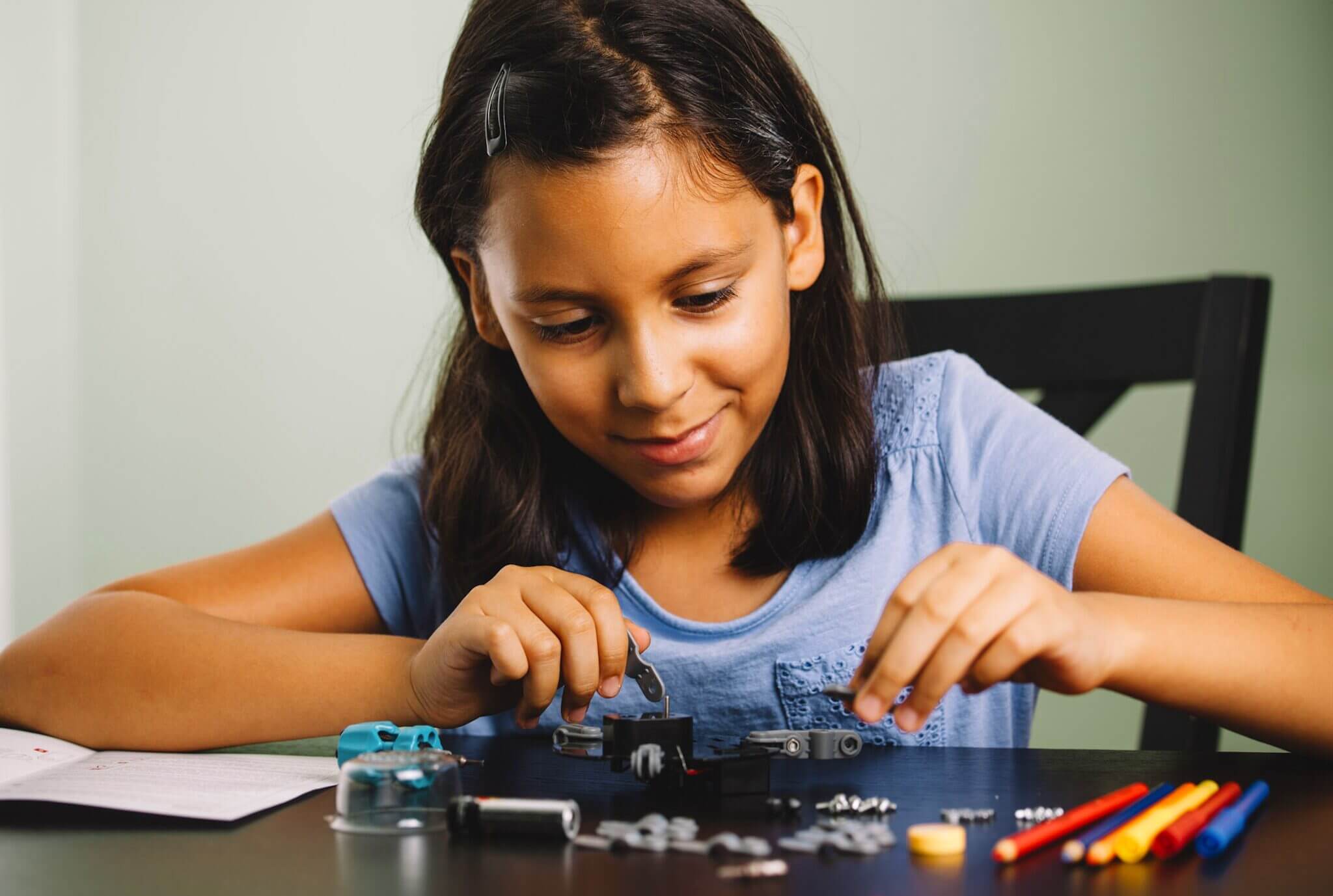 Student playing with LEGOs